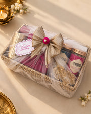 The same tray wrapped in sheer tulle with a gold bow and Festive Greetings tag, ready to gift — Tattva Diwali gift hamper